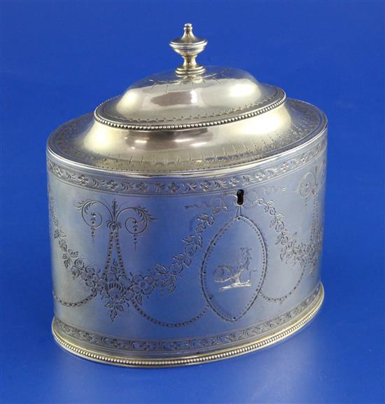 A George III bright cut engraved silver oval tea caddy by Hester Bateman, 10.5 oz.